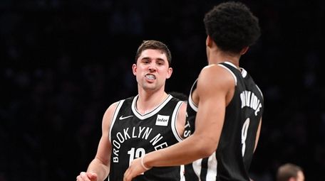Nets guard Joe Harris is congratulated by Spencer