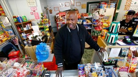 Carl Lewis in his market in Rankin, Pa.,