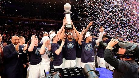 The Villanova Wildcats hold up the trophy after