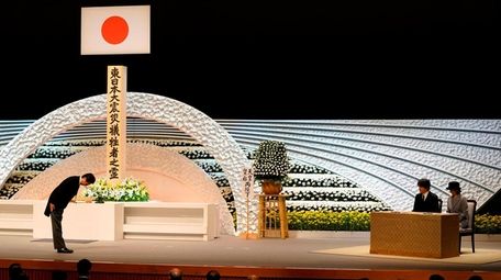 Japanese Prime Minister Shinzo Abe bows to Prince