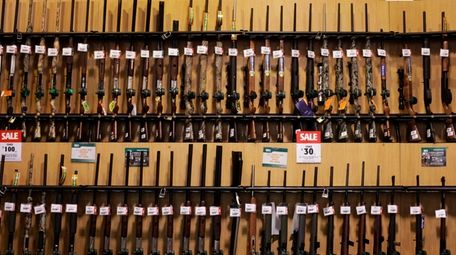 Guns sit on display at Dick's Sporting Goods