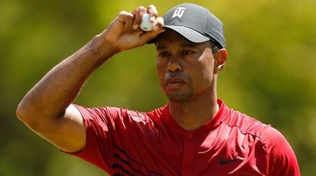 Tiger Woods reacts on the second green during