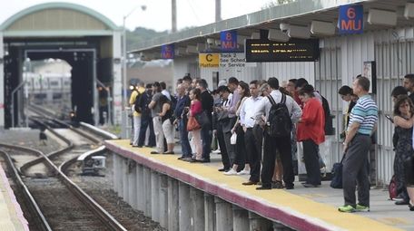 LIRR commuters at the Ronkonkoma station wait for