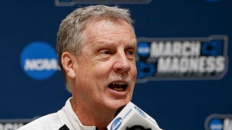 Iona's coach Tim Cluess takes questions during a