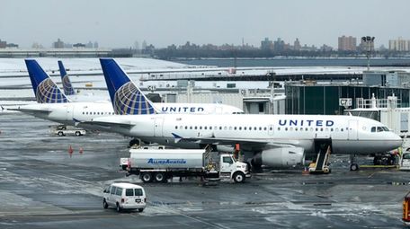 A United Airlines jet sits on the tarmac