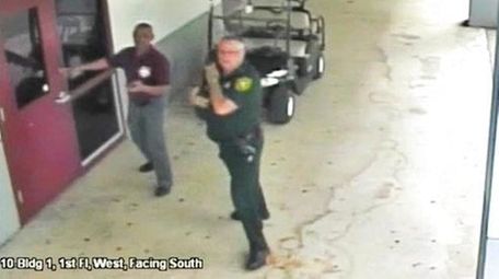 This Feb. 14, 2018 frame from security video