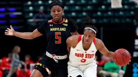 Ohio State guard Kelsey Mitchell, right, dribbles the