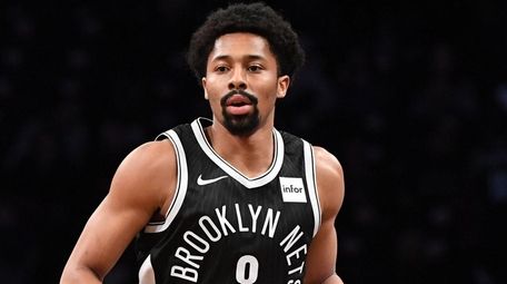 Nets guard Spencer Dinwiddie dribbles the ball up