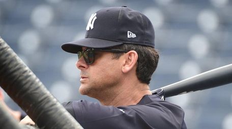Yankees Manager Aaron Boone watches batting practice during