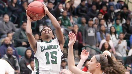 Elmont's Zhaneia Thybulle (15) puts one up and