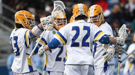 Hofstra players celebrate a goal by Jimmy Yanes