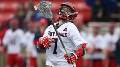 Stony Brook's Jack Walsh looks to control the