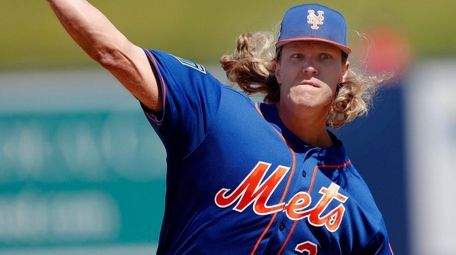 Mets starting pitcher Noah Syndergaard works in the