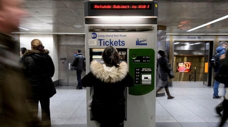Long Island Rail Road passengers purchase tickets at