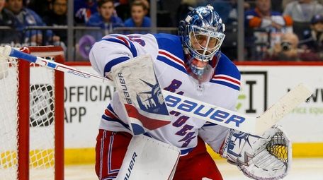 Henrik Lundqvist of the Rangers makes a save