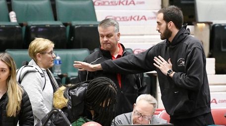 Long Island Lutheran coach John Buck, right, makes
