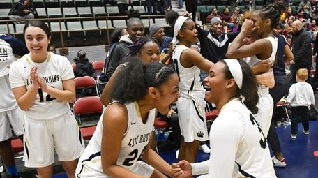 Baldwin players celebrate a 58-49 win against Christ