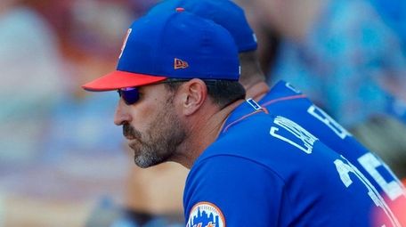 Mets manager Mickey Callaway watches from the dugout