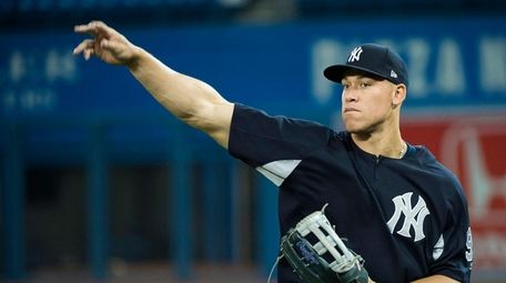 Yankees' Aaron Judge (99) throws the ball during