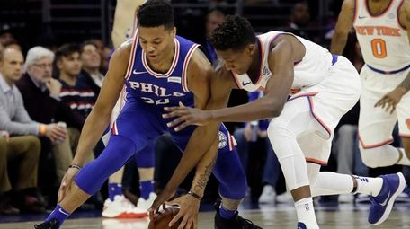 The 76ers' Markelle Fultz, left, and the Knicks'