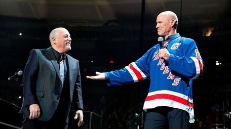 Billy Joel and Mark Messier celebrate the 50th
