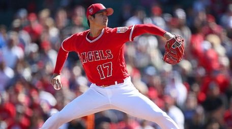 The Angels' Shohei Ohtani works against the Brewers