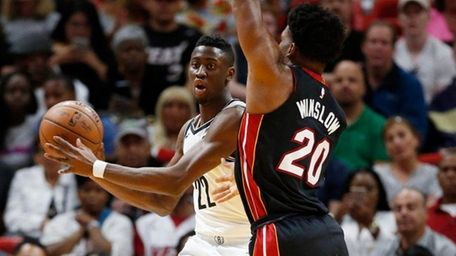 Nets guard Caris LeVert looks for an open