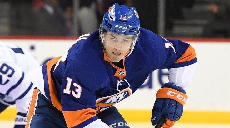 Islanders center Mathew Barzal skates with the puck
