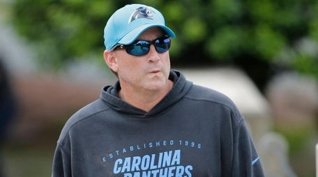 Mike Shula walks to practice during Panthers' rookie