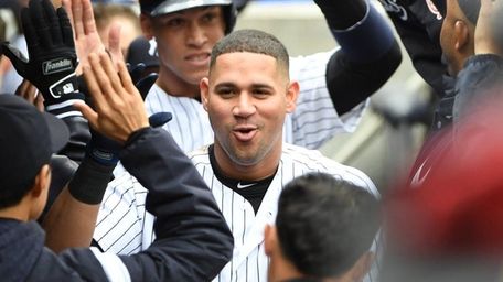 Yankees designated hitter Gary Sanchez is greeted in