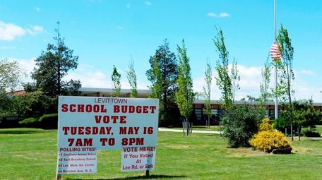 A school budget vote sign.