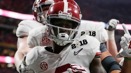 Alabama's Calvin Ridley celebrates his touchdown catch during