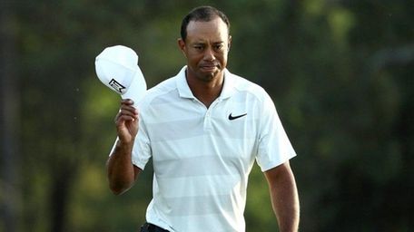 Tiger Woods acknowledges the crowd as he walks