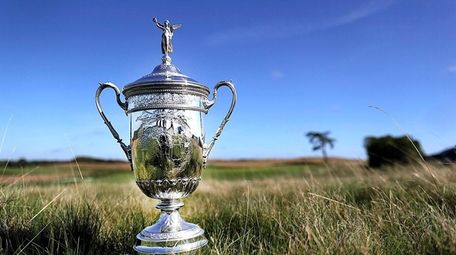 The U.S. Open trophy sits in the fescue