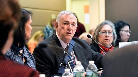 Roger Tilles, center, who represents Long Island on