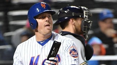 Mets rightfielder Jay Bruce reacts after he struck