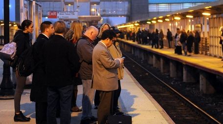 Commuters wait at the Long Island Rail Road's