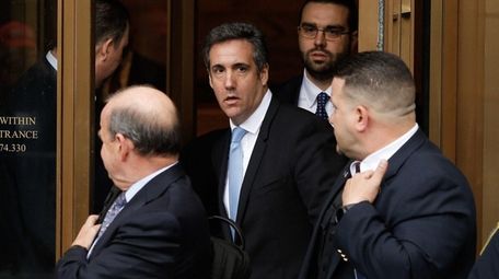 President Donald Trump's personal attorney Michael Cohen leaves