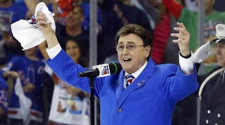 John Amirante sings the national anthem before Game