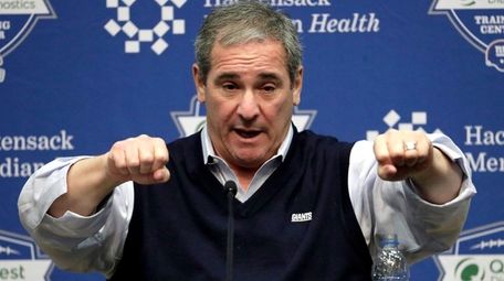 Giants general manager Dave Gettleman speaks to reporters