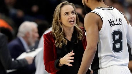 Spurs assistant coach Becky Hammon talks with Patty