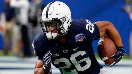 Penn State running back Saquon Barkley runs the