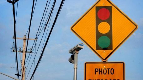 A red light camera on Middle Country Road