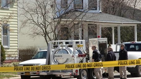 Police outside a Lynbrook home after residents found