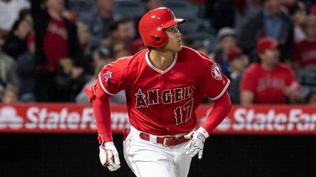 Angels designated hitter Shohei Ohtani watches his solo