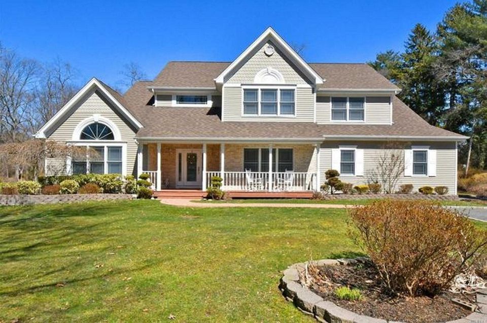 This South Huntington Colonial includes five bedrooms and