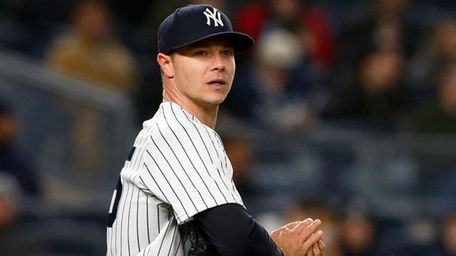 Yankees pitcher Sonny Gray looks on during a