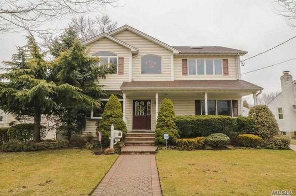 This Malverne Colonial, includes four bedrooms and three