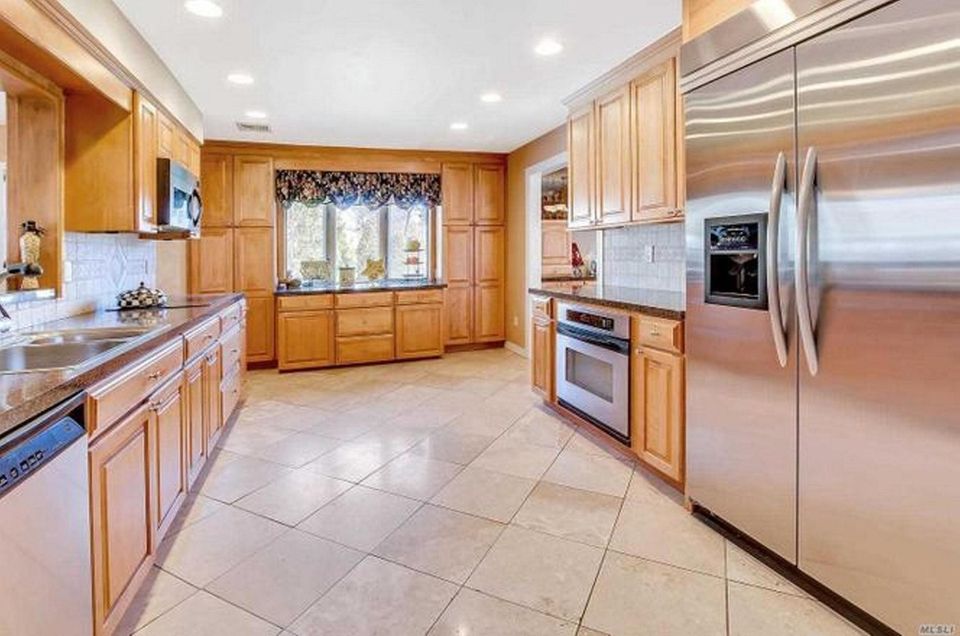 The kitchen in this Hauppauge Colonial includes stainless