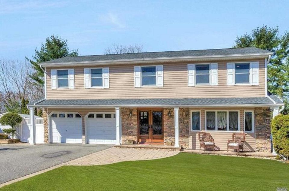 This Hauppauge Colonial includes four bedrooms and 3